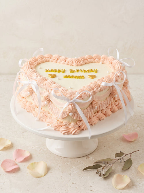 Elegant Heart-Shaped Pink Celebration Cake