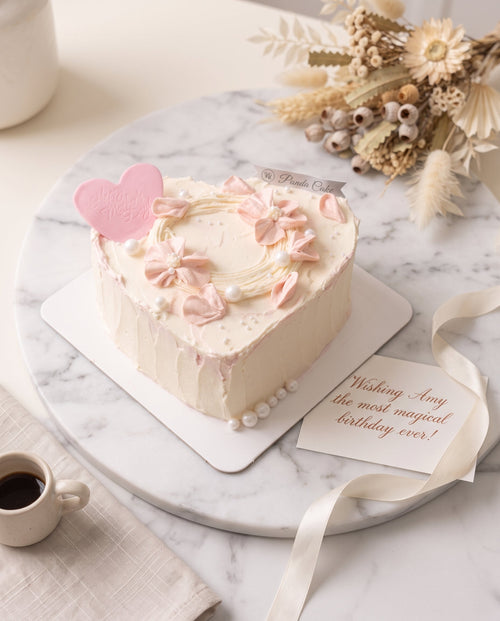 Delicate Heart-Shaped Pink Floral Cake